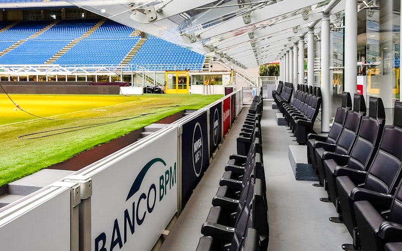 San Siro Stadium seating area with view of the field and stands in Milan, Italy.