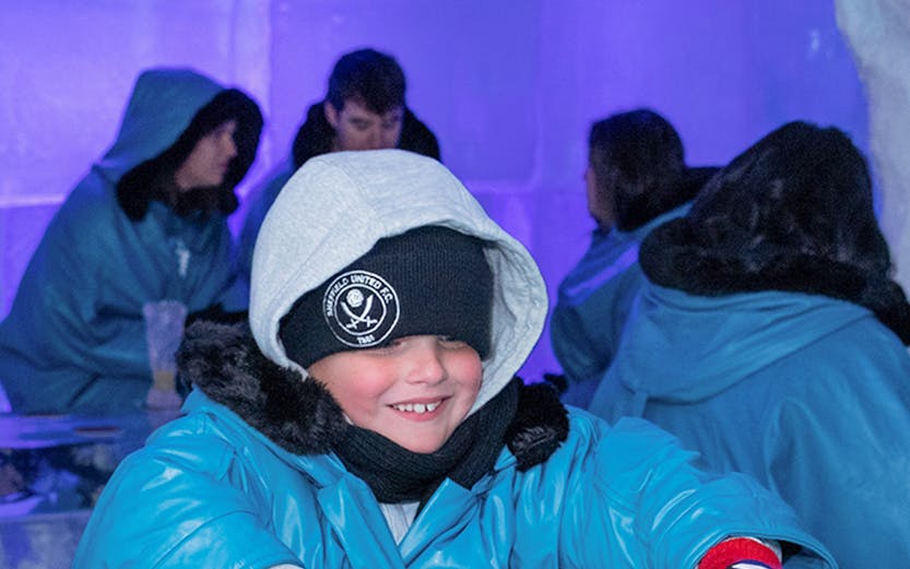 Child playing ice hockey game at IceBar Gold Coast.
