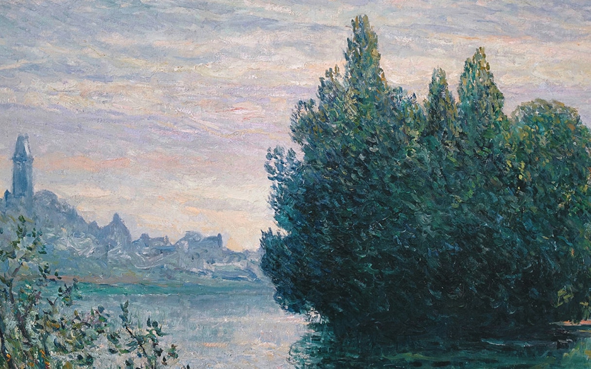 Painting of a riverbank with trees and distant buildings, featured at Fundación MAPFRE Recoletos Room, Madrid.