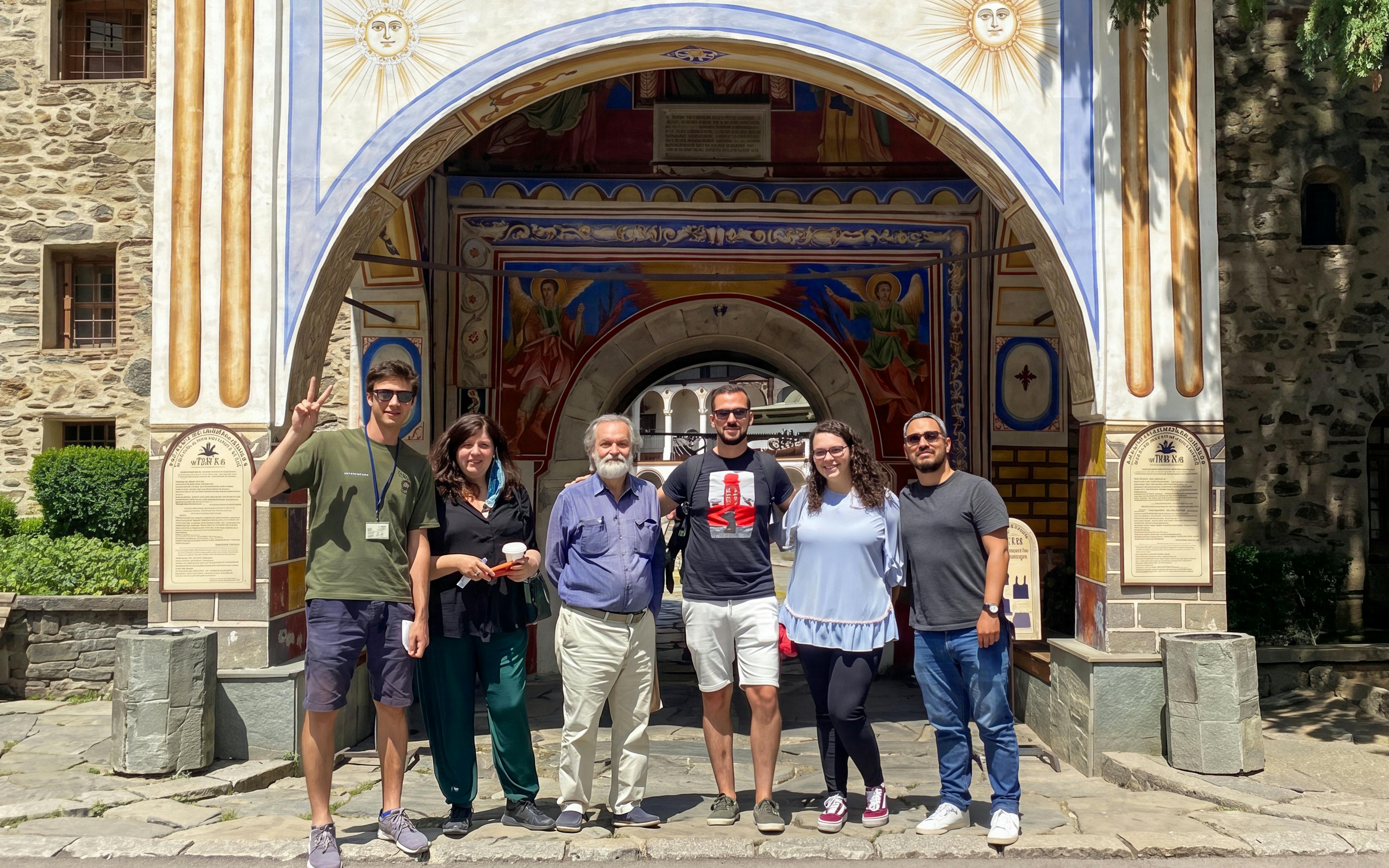 Group of tourists at Rila Monastery entrance, Sofia day trip.