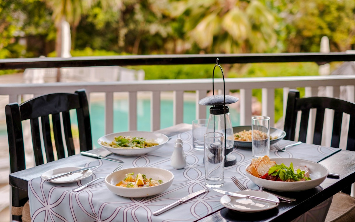 Lunch set on table at Malolo Island Resort, Fiji with garden view.