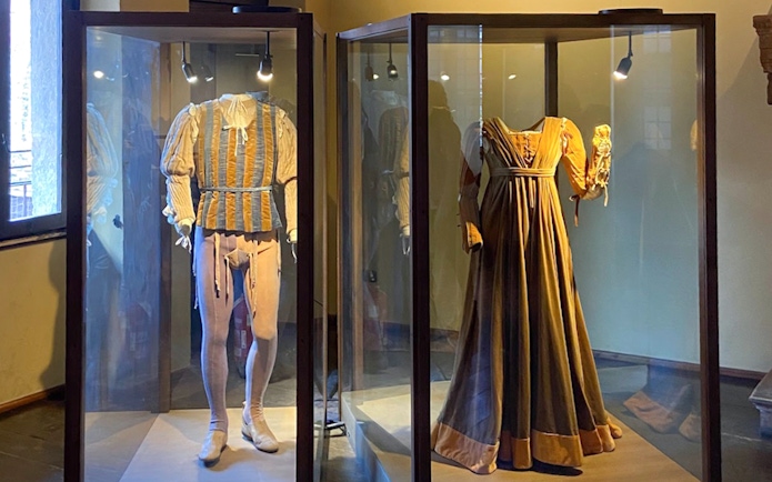 Period costumes displayed at Juliet’s House museum in Verona.