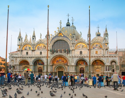 Tourists exploring St. Mark's Basilica with skip-the-line tickets and audioguides in Venice, Italy