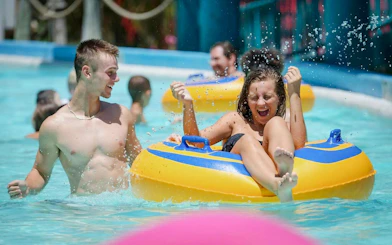 People enjoying a water ride at Hurricane Harbor Chicago.