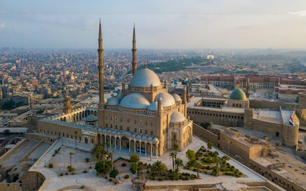Citadel of Saladin in Cairo with cityscape in the background.