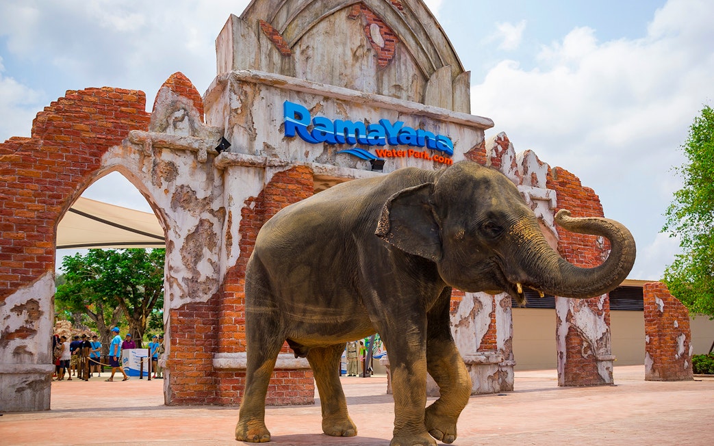 Elephant standing at the entrance of Ramayana Water Park, Thailand.