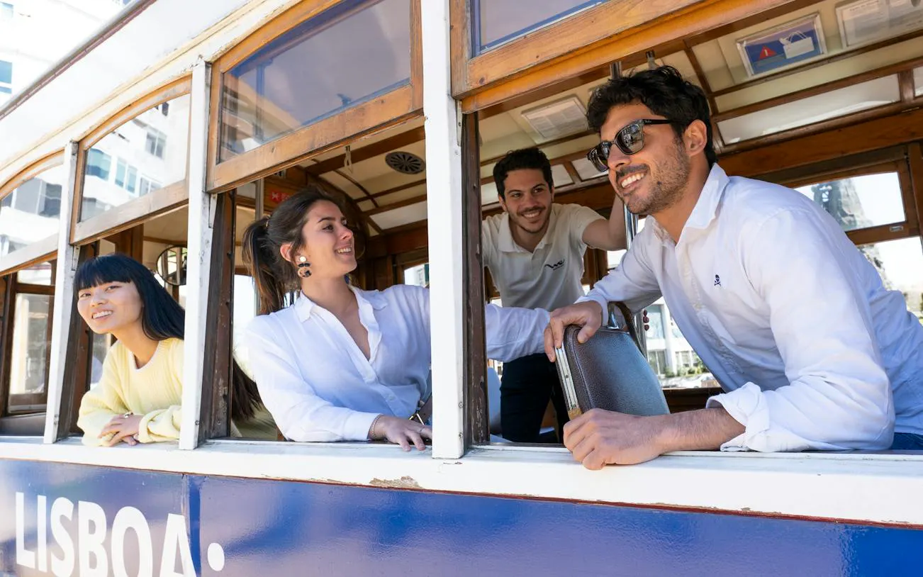 Group enjoying a tram ride in Lisbon's historic center.