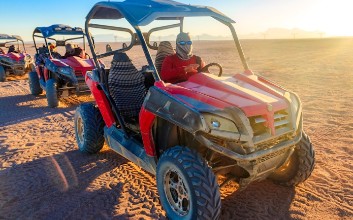 Buggy ride at sunset in the Palmeraie desert, Morocco.