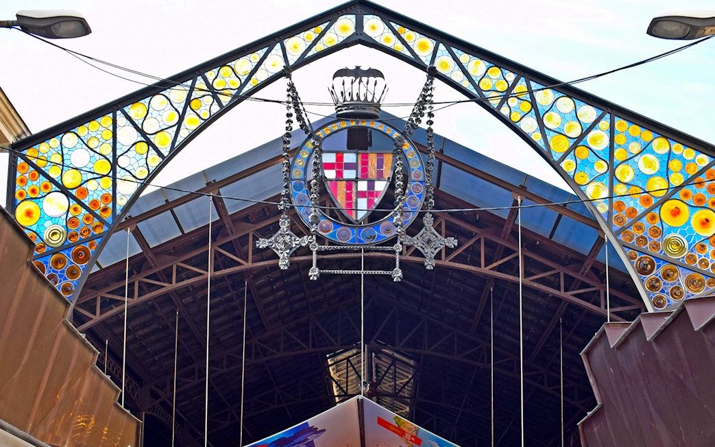 Entrance of La Boquería market with colorful stained glass, Barcelona Markets Walking Tour.