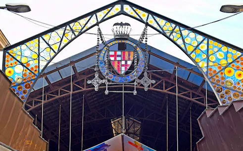 Entrance of La Boquería market with colorful stained glass, Barcelona Markets Walking Tour.