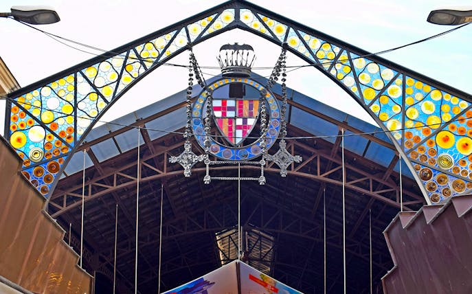 Entrance of La Boquería market with colorful stained glass, Barcelona Markets Walking Tour.