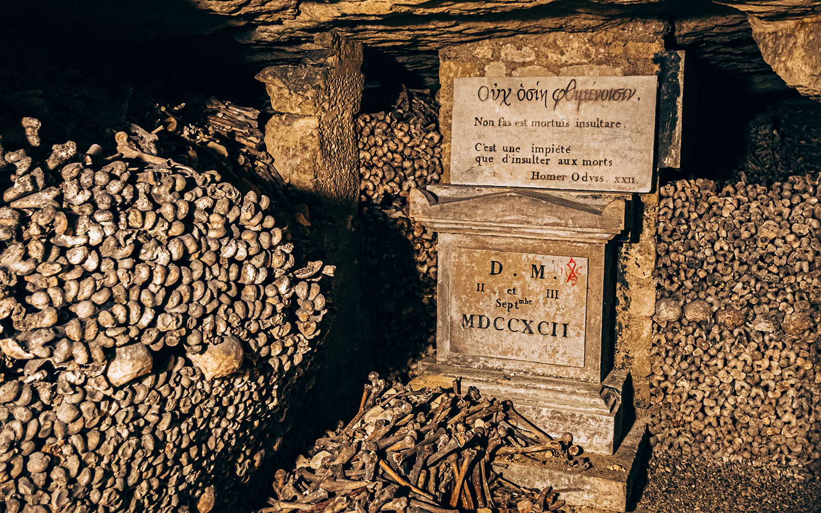 Bones and inscription in the Paris Catacombs.