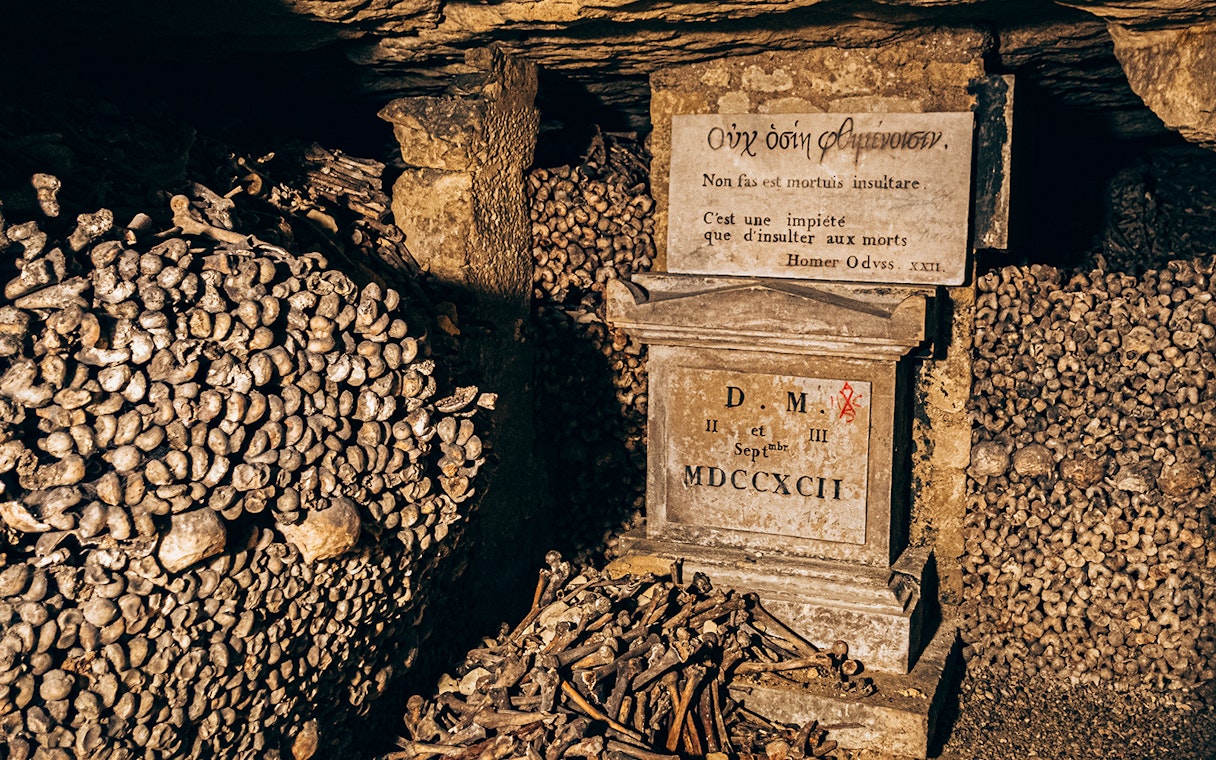 Bones and inscription in the Paris Catacombs.