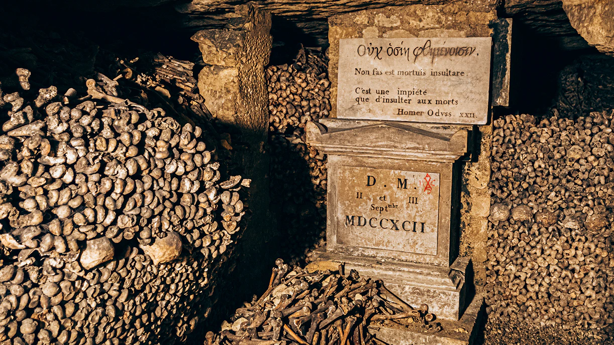 Bones and inscription in the Paris Catacombs.