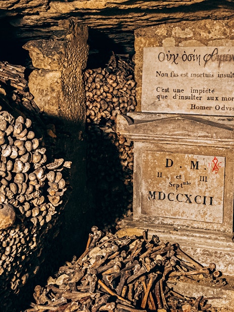 Bones and inscription in the Paris Catacombs.
