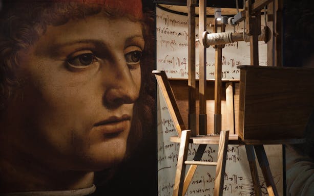 Leonardo da Vinci exhibit with machinery and manuscript display.