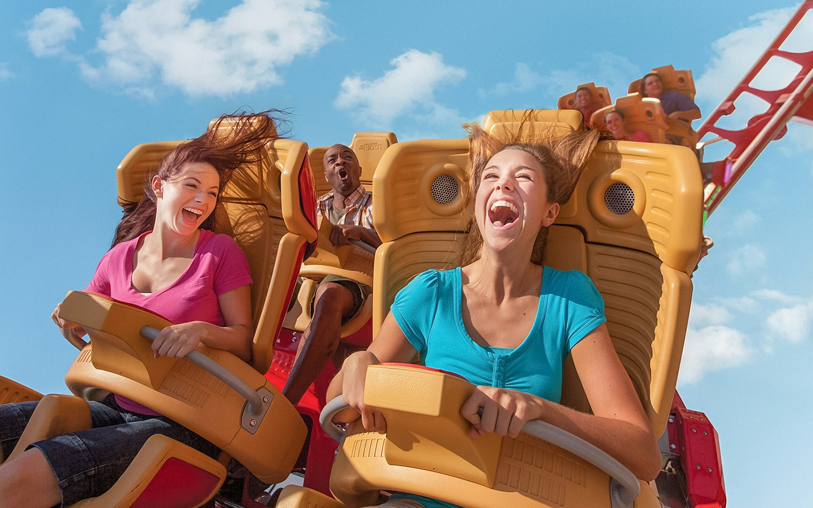 Visitors enjoying a roller coaster ride at Universal Orlando.