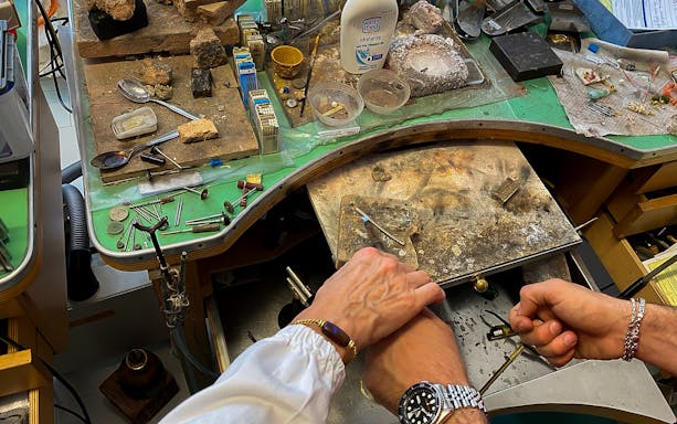Jewelry-making tools and hands crafting in Sardinian workshop, Oristano.