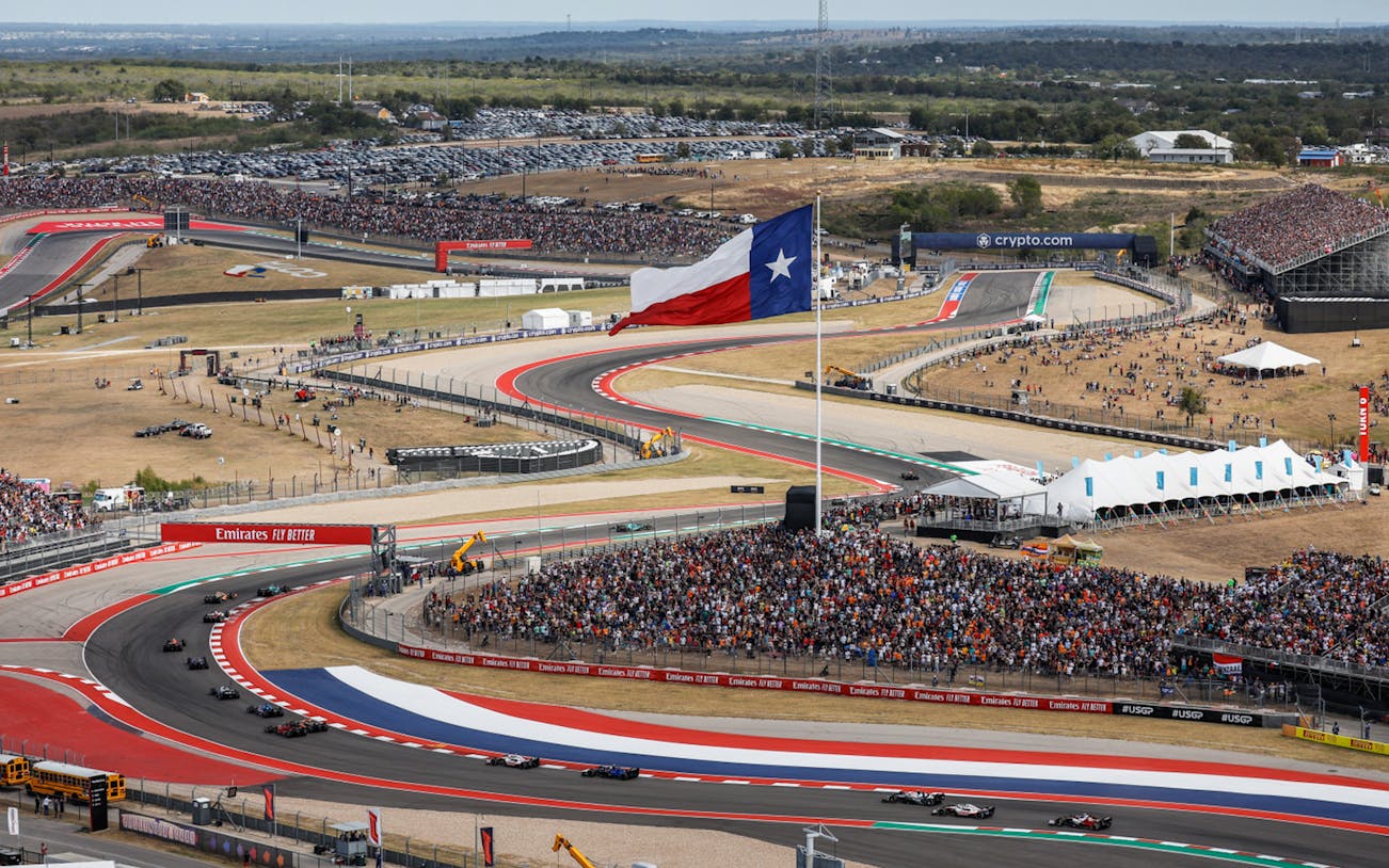 Formula 1 cars racing at Circuit of the Americas, Texas, during USA Grand Prix.