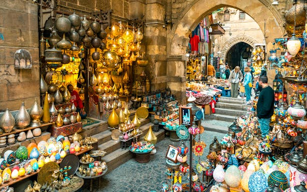 Khan el-Khalili market in Cairo with colorful lamps and souvenirs displayed.