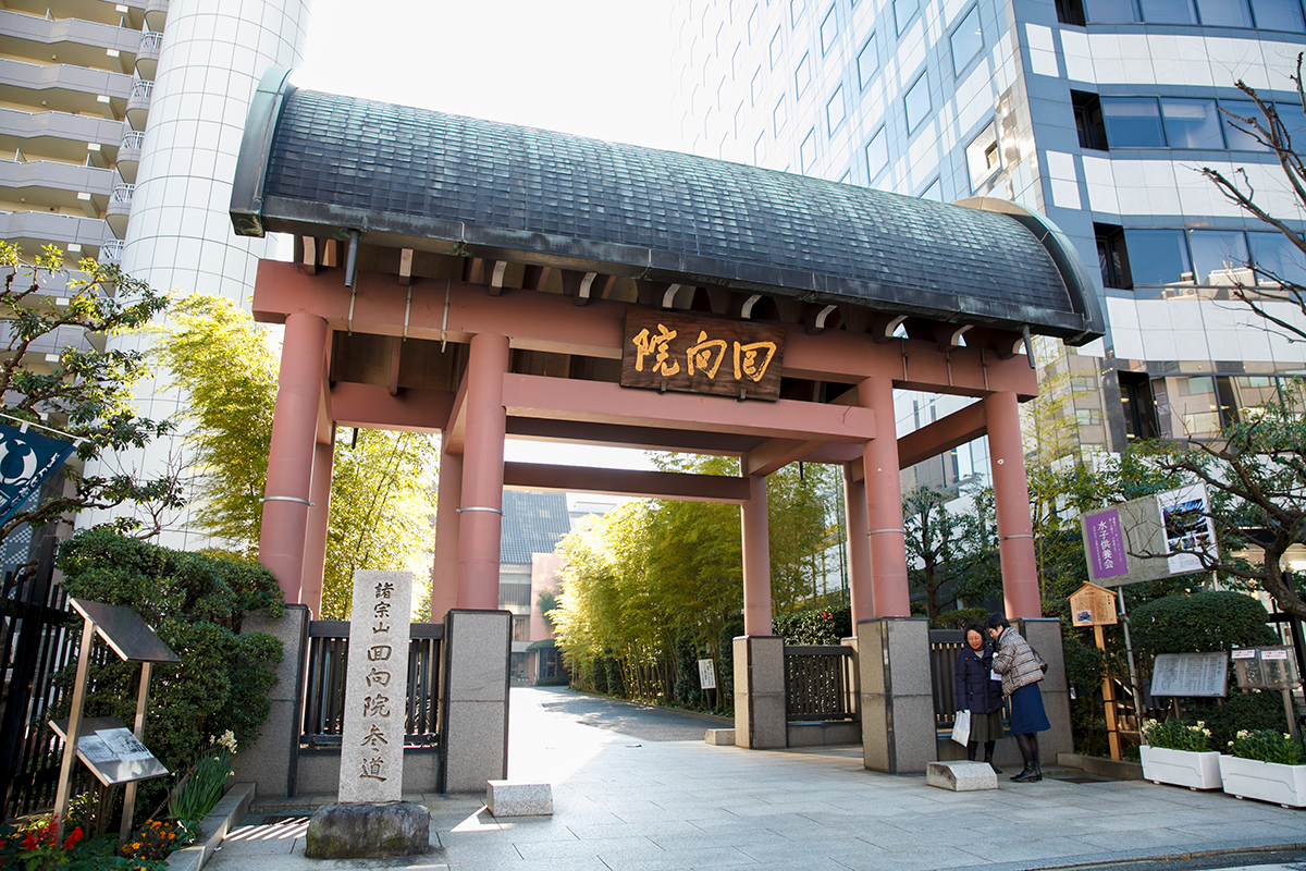 Entrance to Ryogoku Kokugikan sumo stadium in Tokyo, featuring traditional architecture.