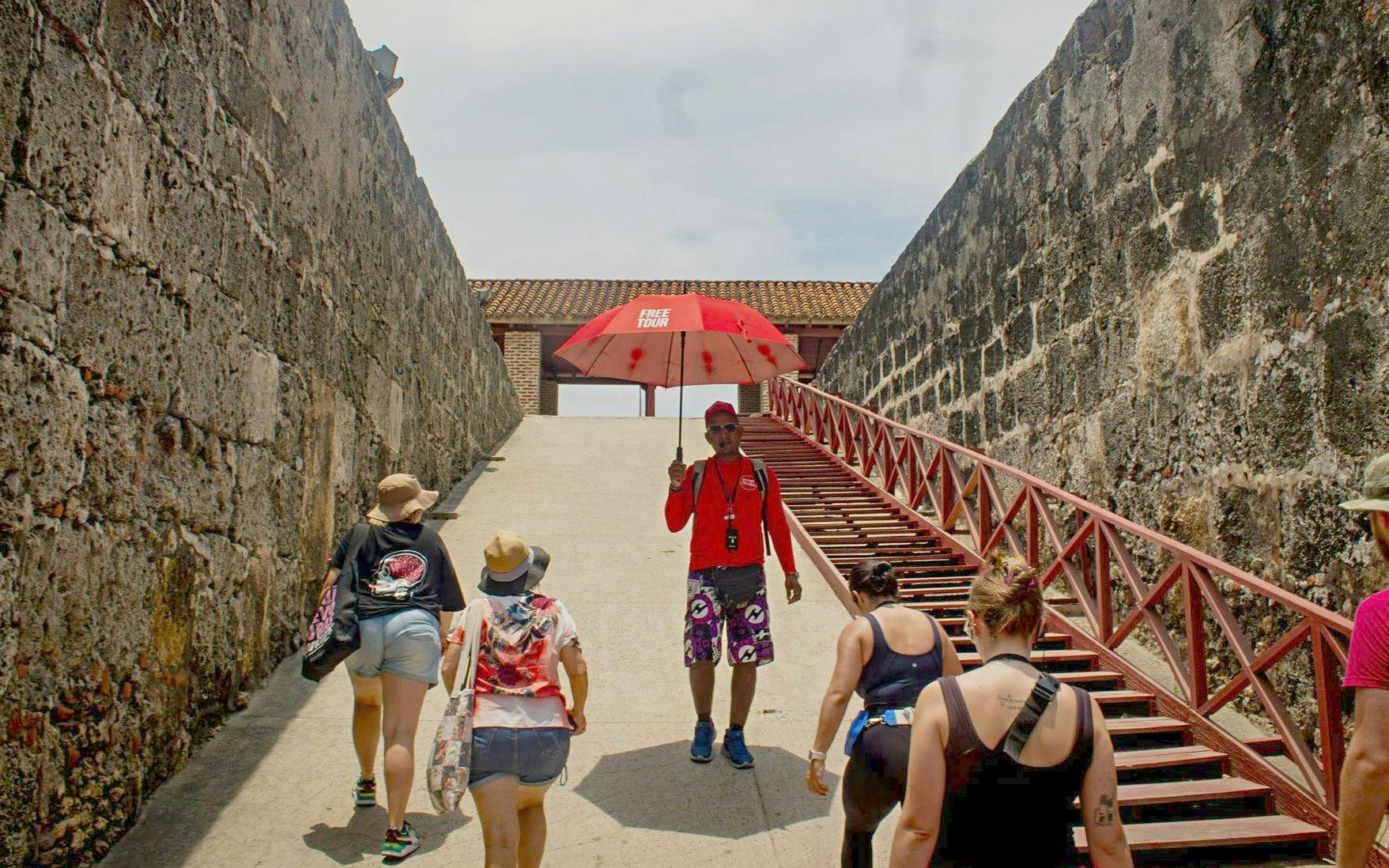 Visitors exploring Cartagena's historic city walls on a guided tour.