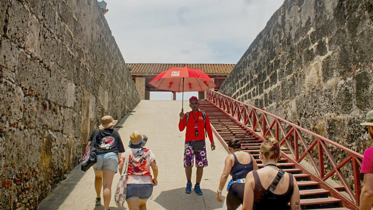 Visitors exploring Cartagena's historic city walls on a guided tour.