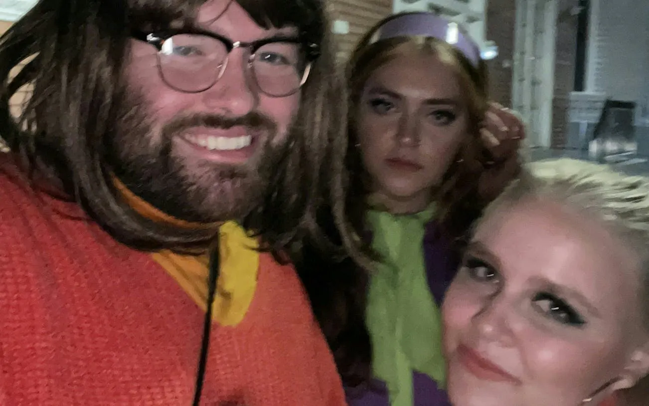 Group dressed in costumes for Ghosts of New Orleans self-guided city exploration game.