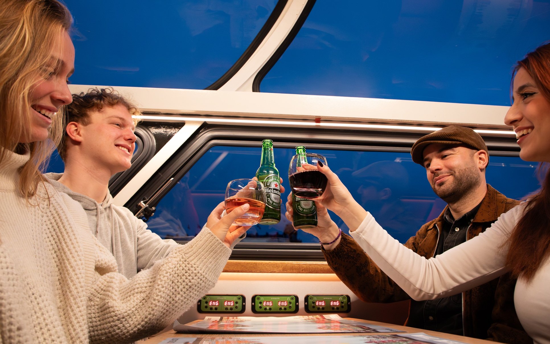 Guests enjoying drinks on the Lovers Canal Cruise in Amsterdam.