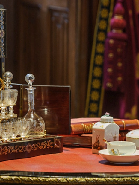 Antique tea set and crystal decanter on display at Azay-le-Rideau interiors.