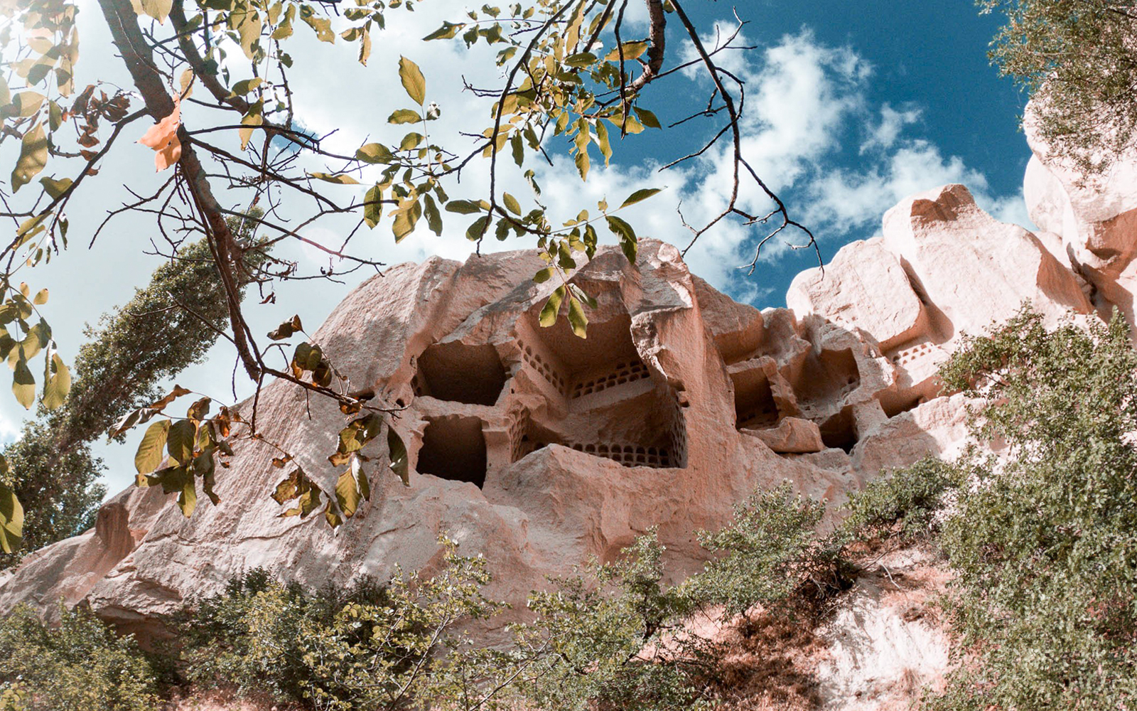 Group of tourists exploring the unique rock formations of Cappadocia during the Red Tour, with a visit to the Fairychimney and Zelve Open-Air Museum