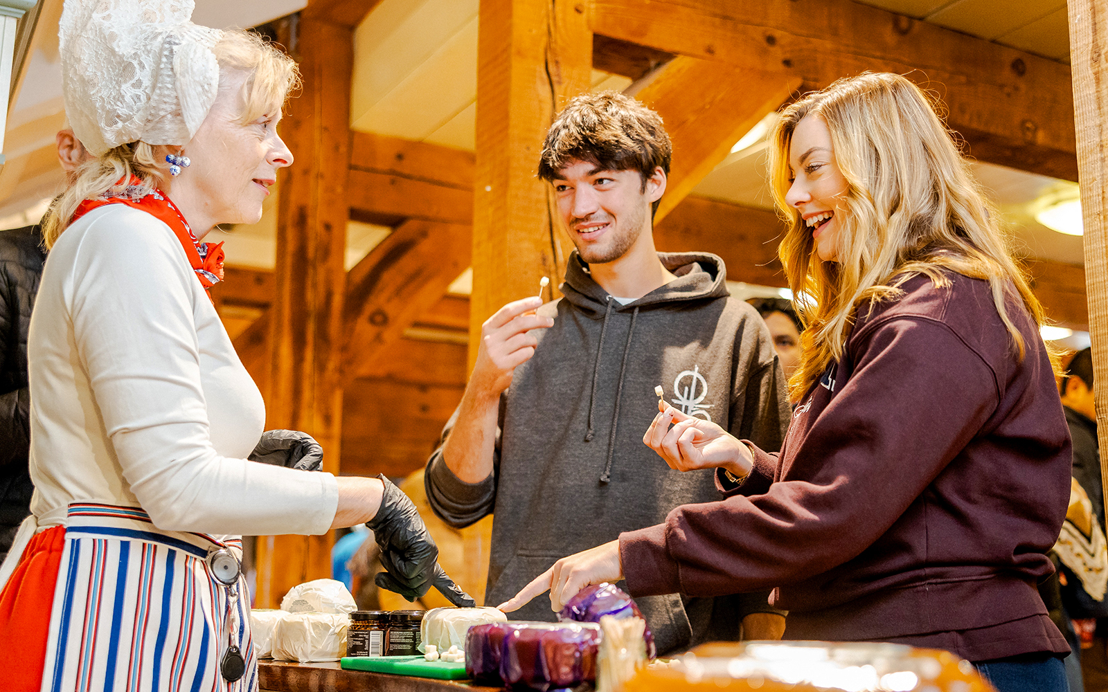 Cheese tasting experience at Zaanse Schans with visitors sampling local varieties.