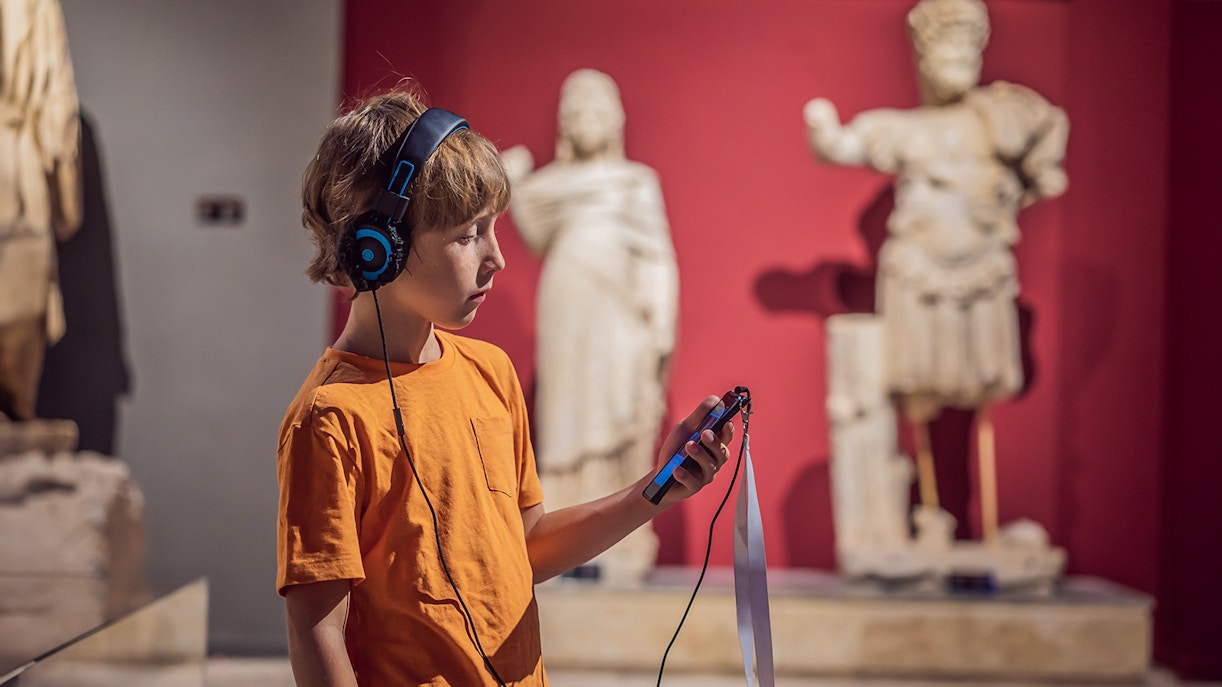 Visitors using audio guides