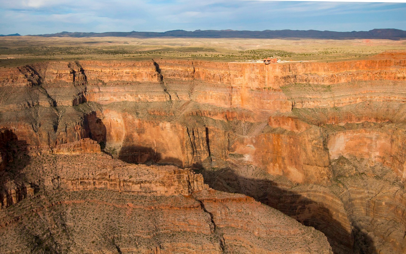 Aerial view of the Grand Canyon West Rim featuring the Skywalk Bridge at Eagle Point, Hualapai Nation.