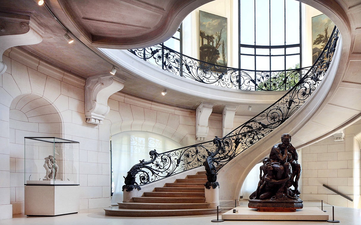 Elegant staircase and sculpture inside Petit Palais, Paris, with Bruno Liljefors exhibition.