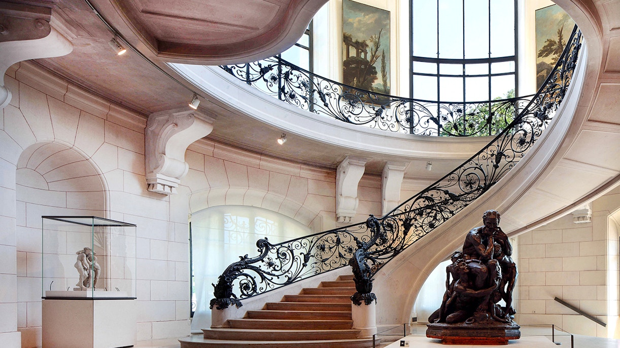 Elegant staircase and sculpture inside Petit Palais, Paris, with Bruno Liljefors exhibition.