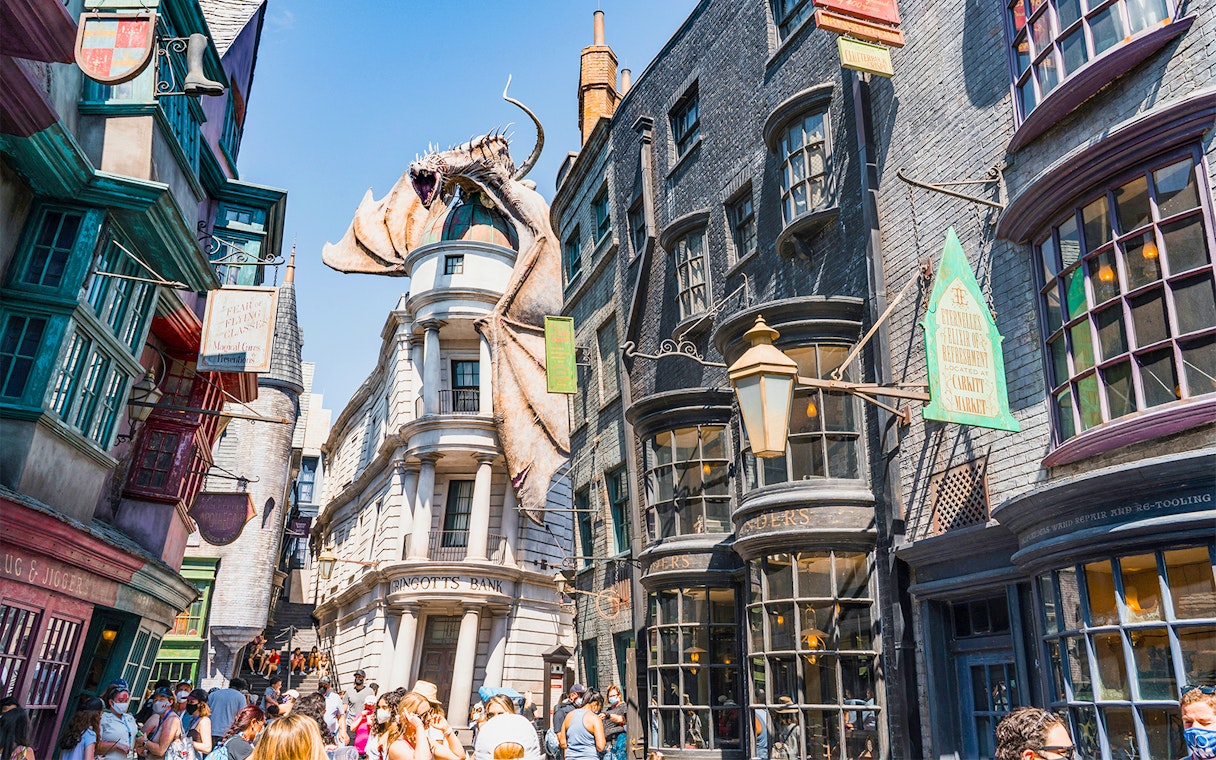 Diagon Alley shops with Gringotts Bank and dragon at Universal Orlando's Wizarding World of Harry Potter.