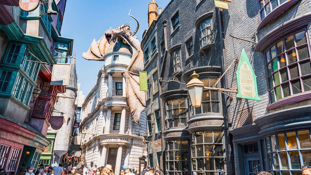 Diagon Alley shops with Gringotts Bank and dragon at Universal Orlando's Wizarding World of Harry Potter.