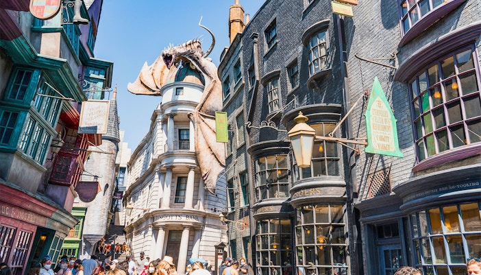 Diagon Alley shops with Gringotts Bank and dragon at Universal Orlando's Wizarding World of Harry Potter.
