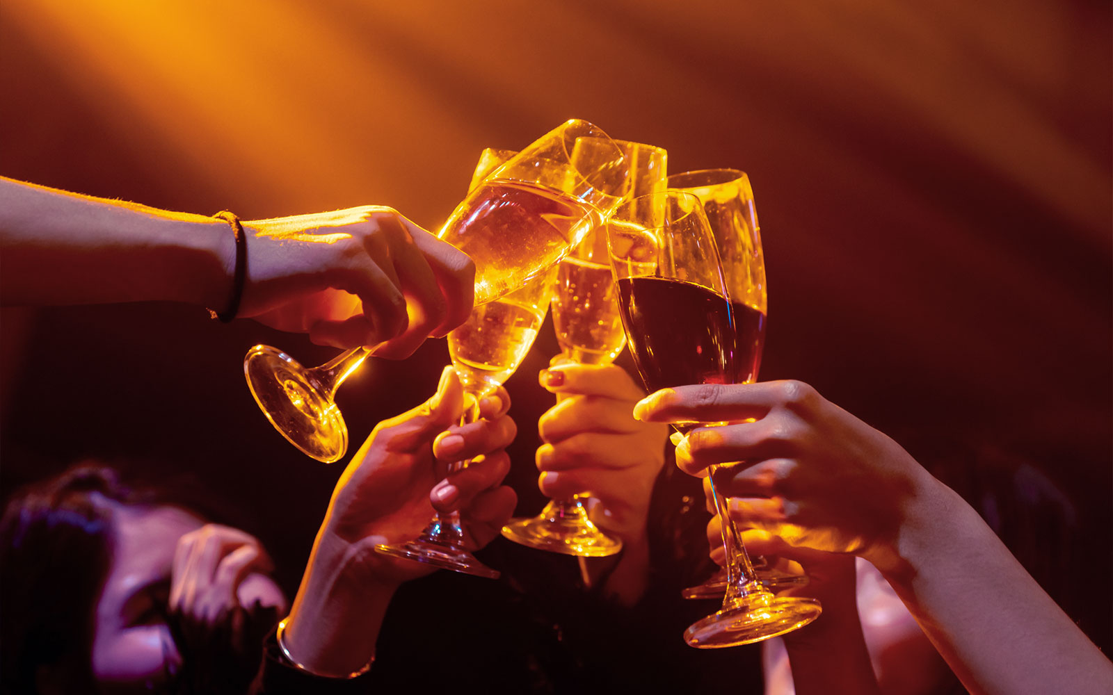 Guests toasting with champagne at PICCADILLY UMEDA Osaka nightclub.