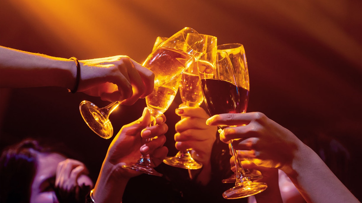 Guests toasting with champagne at PICCADILLY UMEDA Osaka nightclub.