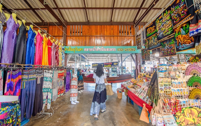 Colorful clothing and souvenirs at Damnoen Saduak Floating Market, Thailand.
