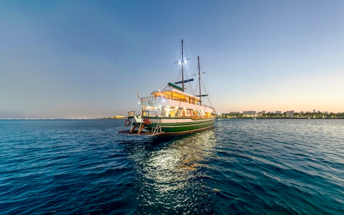 Cruise ship on Blue Lagoon at sunset near Ayia Napa, Cyprus.