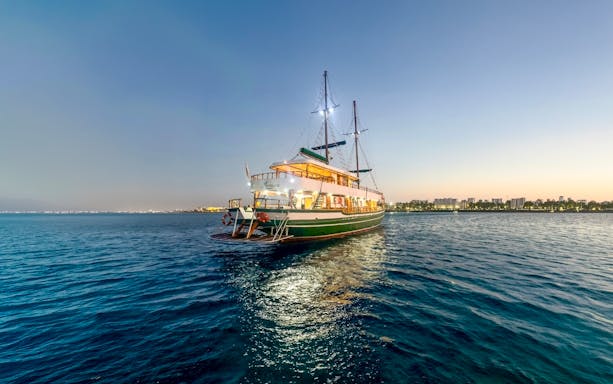 Cruise ship on Blue Lagoon at sunset near Ayia Napa, Cyprus.