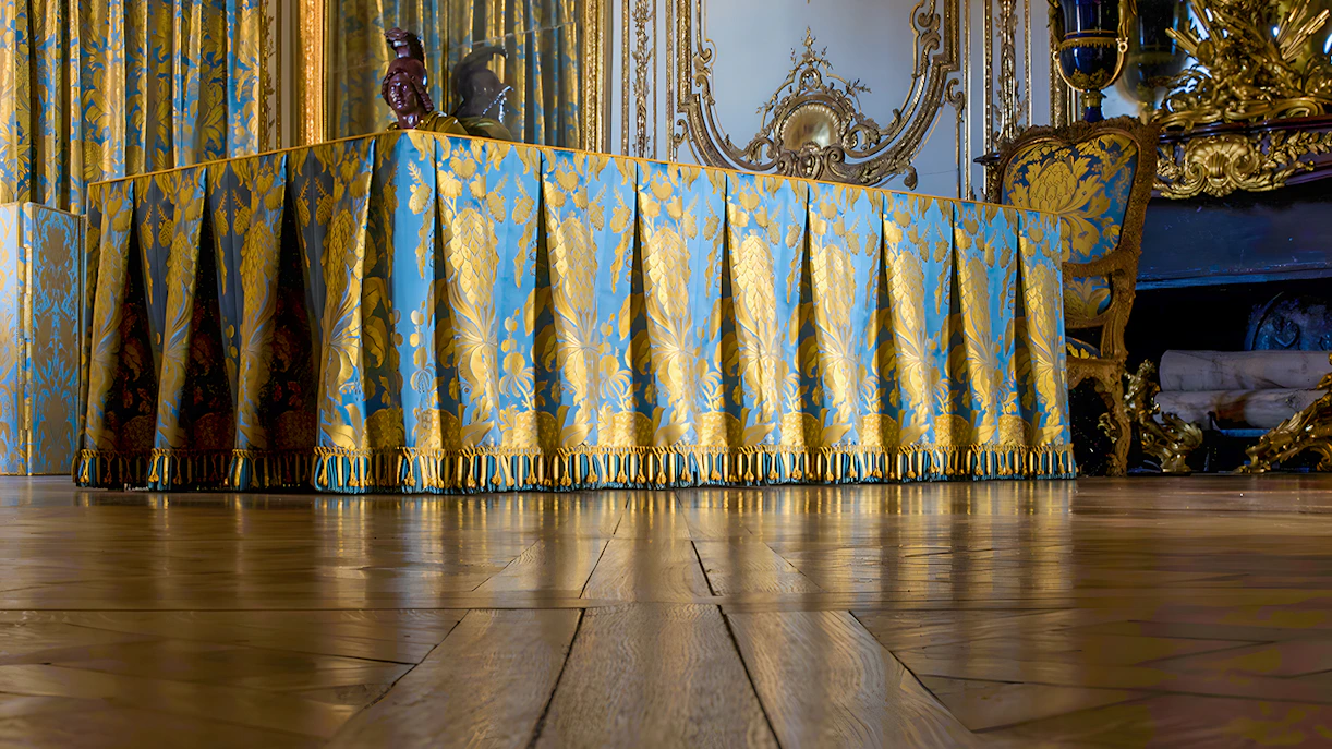 Luxurious draped table in the King's Apartment Council Room, Versailles Palace.