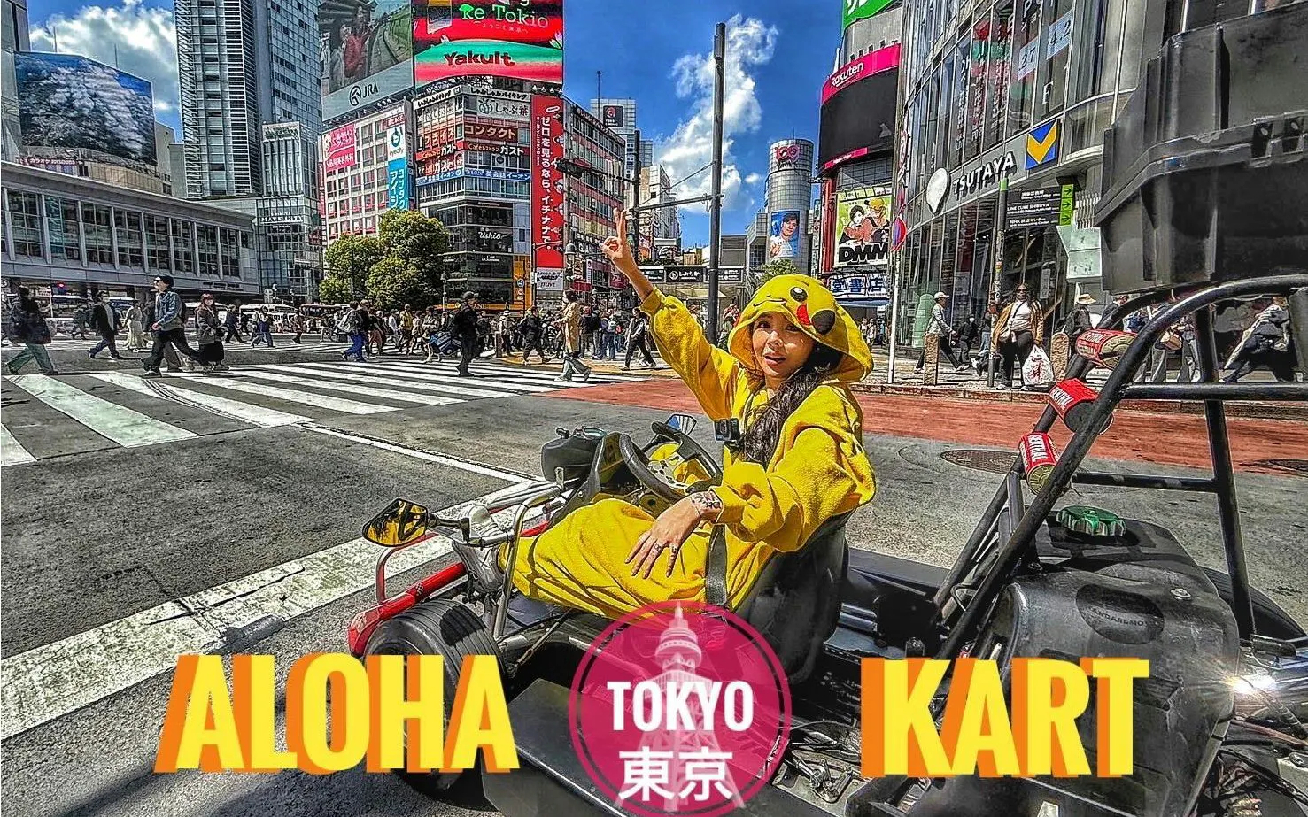 Tourist in costume driving a go-kart at Shibuya Crossing, Tokyo.