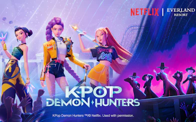 K-pop demon hunters at Everland Resort with roller coaster backdrop.