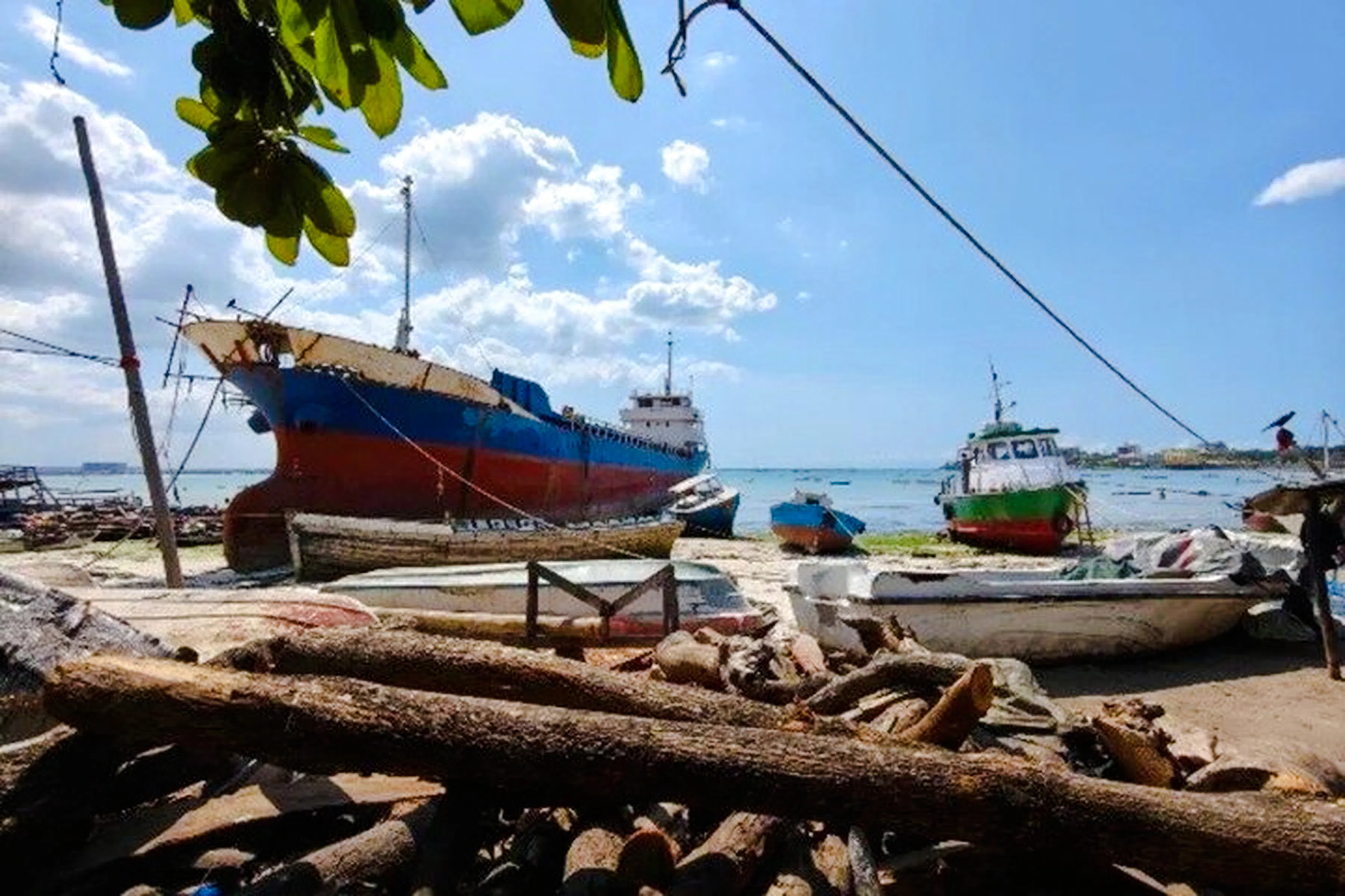 Docked boats at Dar es Salaam fish market, part of Masaki Walking Tuk-Tuk Tour, Zanzibar.