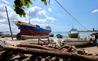 Docked boats at Dar es Salaam fish market, part of Masaki Walking Tuk-Tuk Tour, Zanzibar.