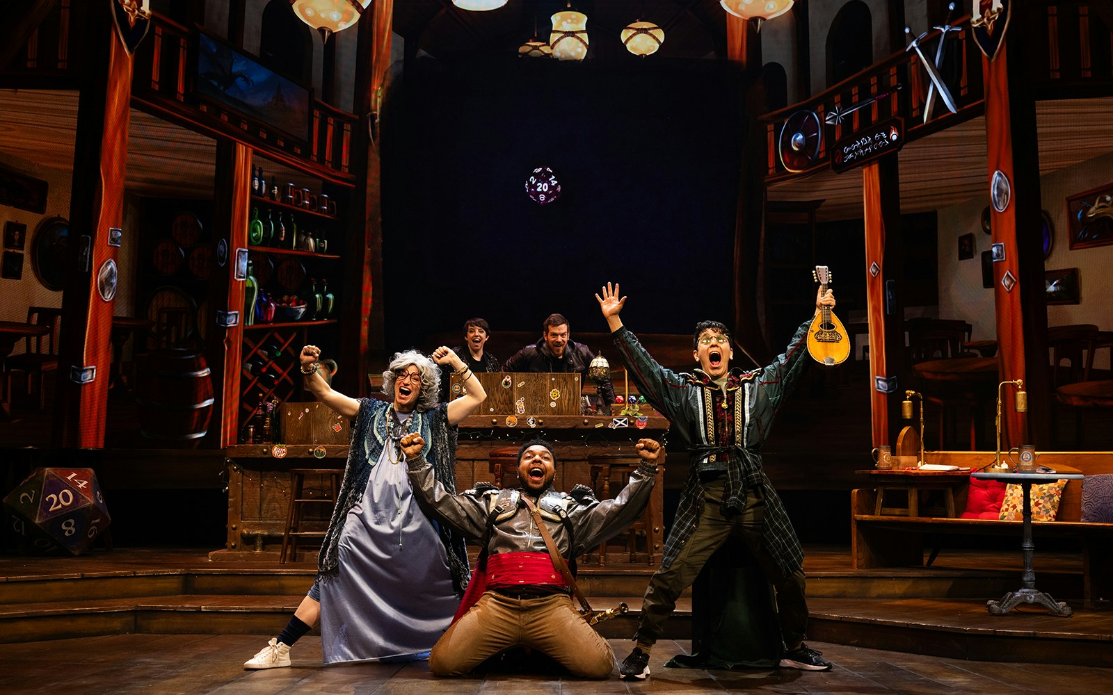 Performers on stage in a lively scene from Dungeons & Dragons: The Twenty-Sided Tavern.